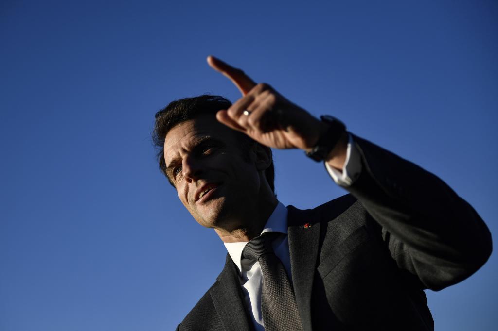 French President Emmanuel Macron makes a remark as he attends a soccer training session for neurodivergent children and youths with symptoms of autism spectrum disorder