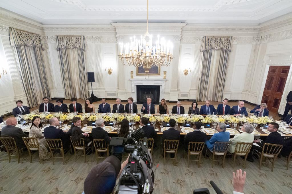 President Donald Trump hosts a dinner with first lady Melania Trump in the State Dinning Room of the White House