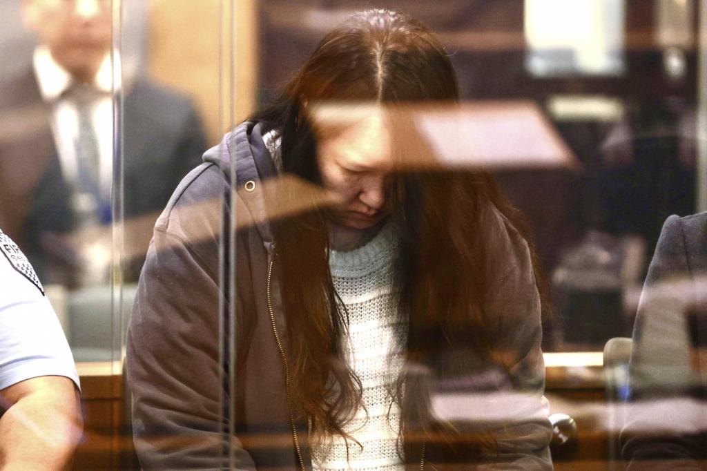 Hakyung Lee stands in the dock at the High Court in Auckland