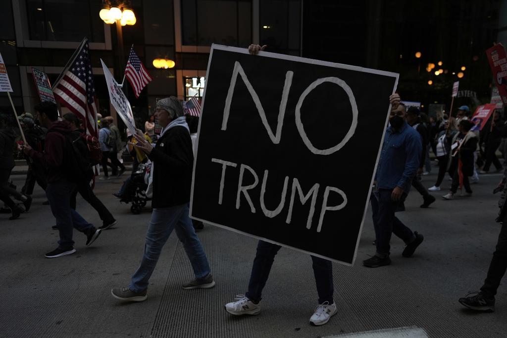 People march during Illinois Coalition for Immigrant & Refugee Rights' "Chicago Says No Trump No Troops" protest