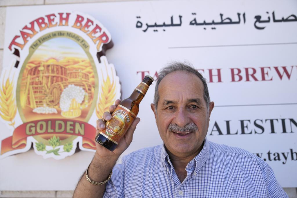 General Director Nadim Khoury shows a bottle of Taybeh beer