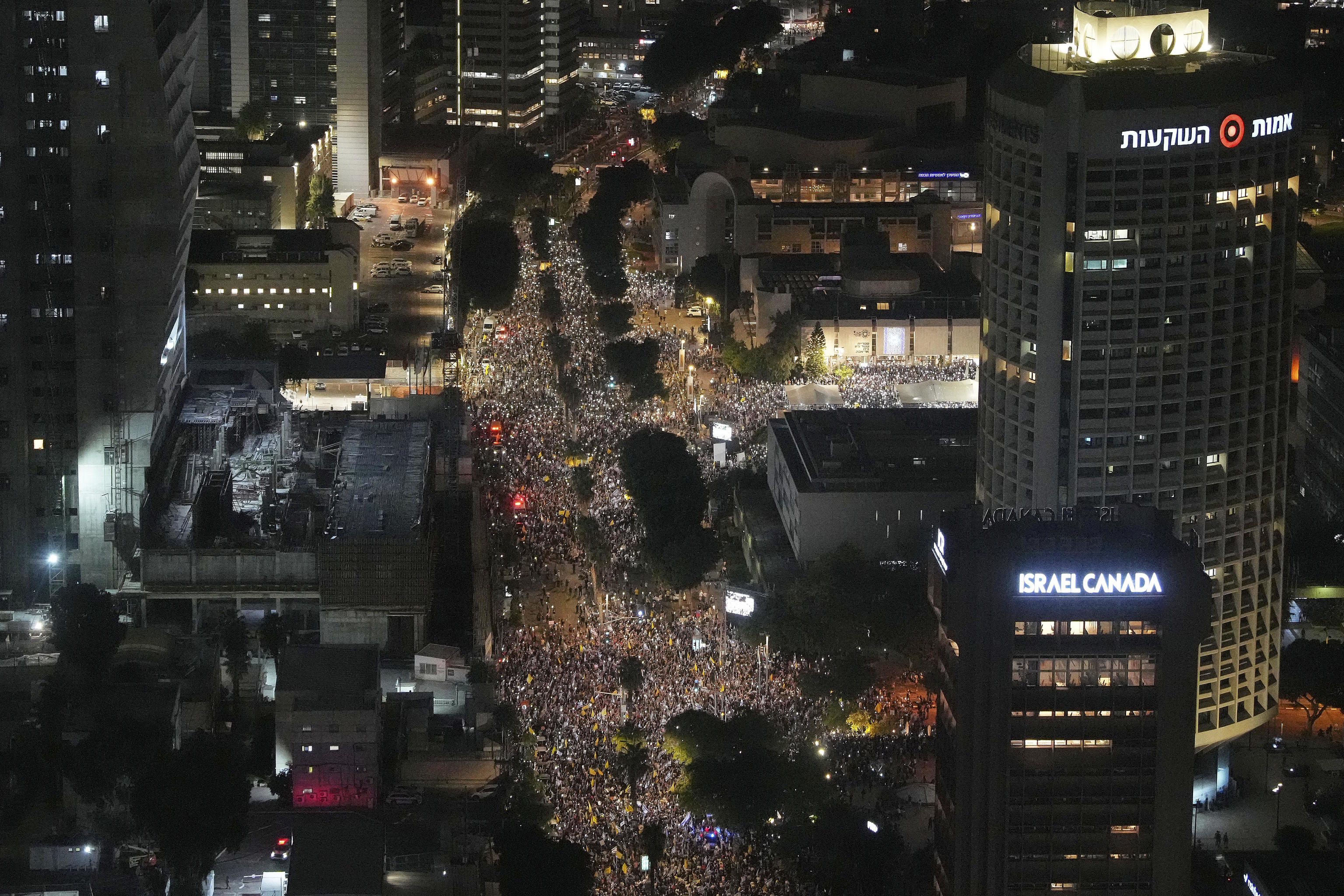 People take part in a protest demanding the release of all hostages held by Hamas and calling for an end to the war in the Gaza Strip, in Tel Aviv.