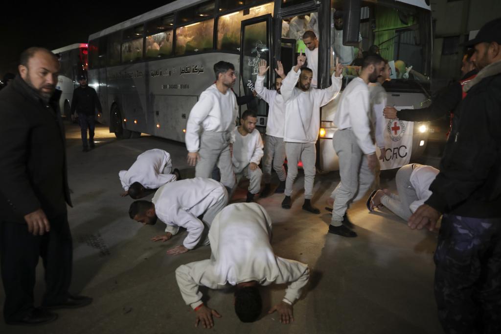 Freed Palestinian prisoners react as they arrive in the Gaza Strip