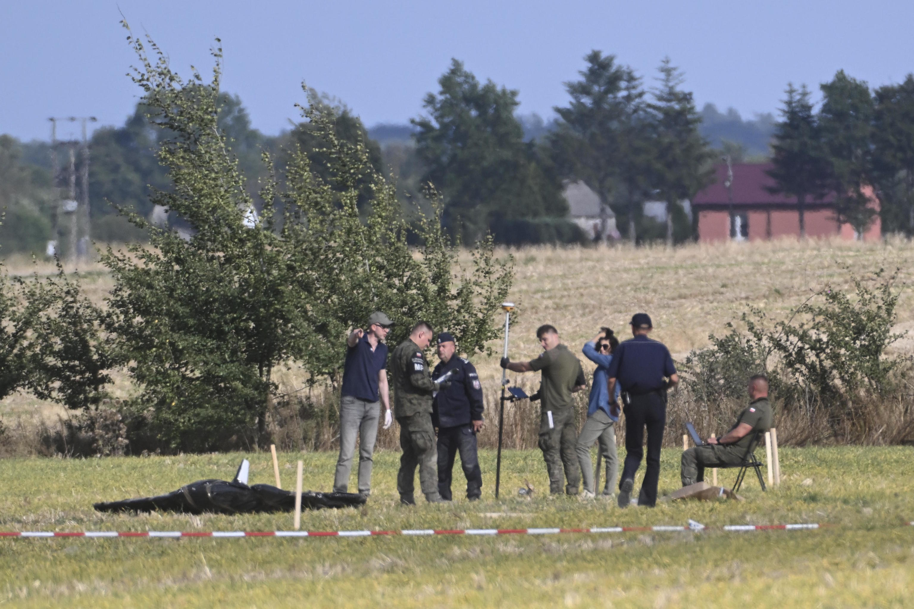 Police secure parts of a damaged UAV shot down by Polish authorities.