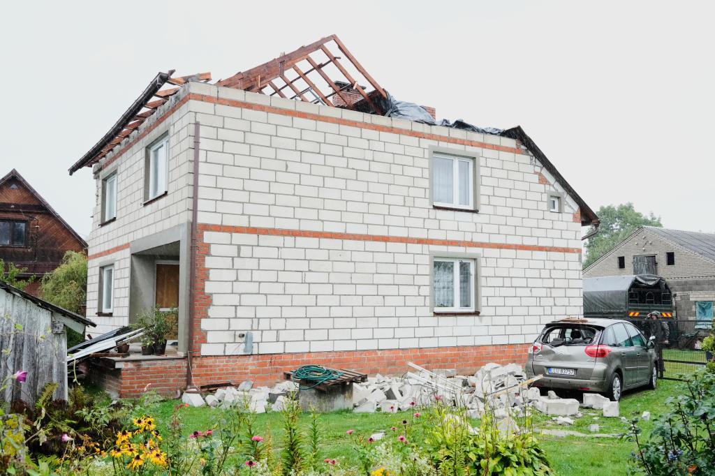 A car damaged by debris falling from a destroyed roof, after Russian drones violated Polish airspace