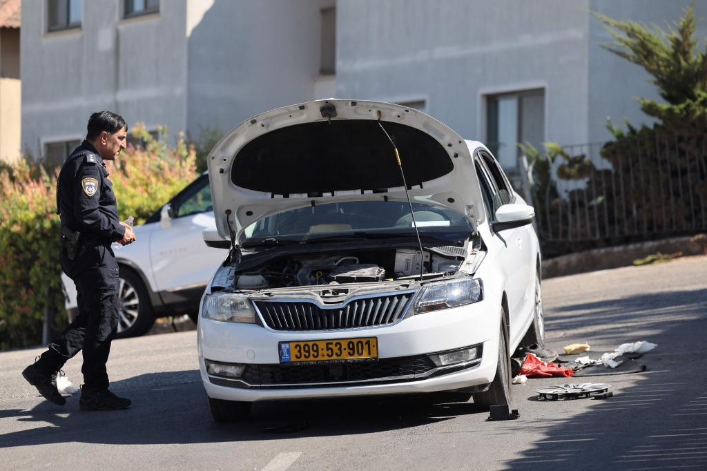 An Israeli policeman inspects the site of a stabbing attack in Tzuba (Tzova)
