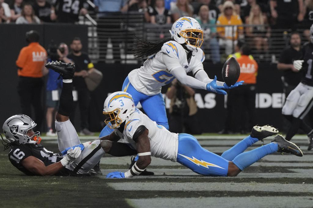Los Angeles Chargers cornerback Donte Jackson (26) intercepts a pass intended for Las Vegas Raiders wide receiver Jakobi Meyers (16)