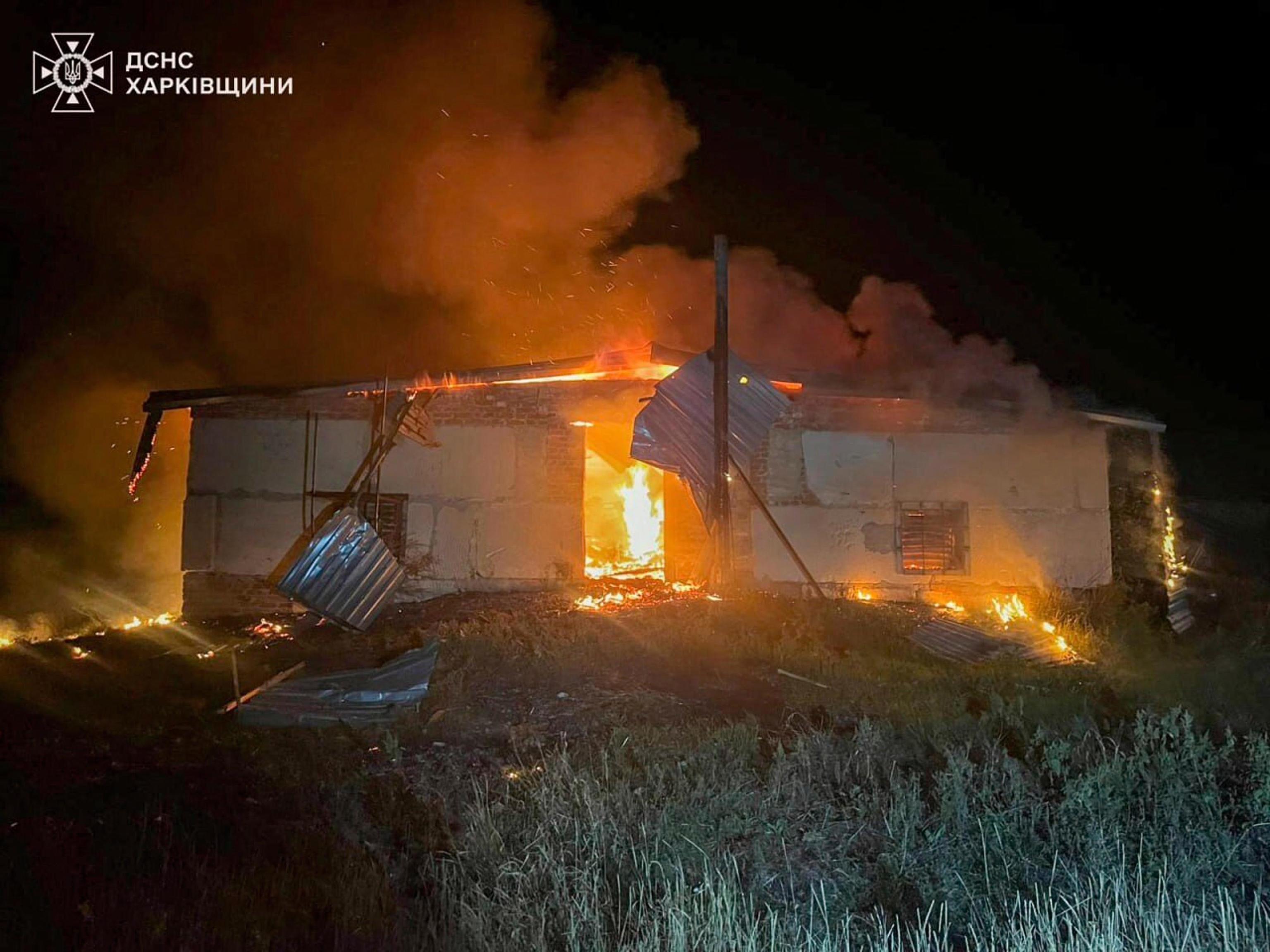 Ukrainian firefighters are trying to extinguish a fire.