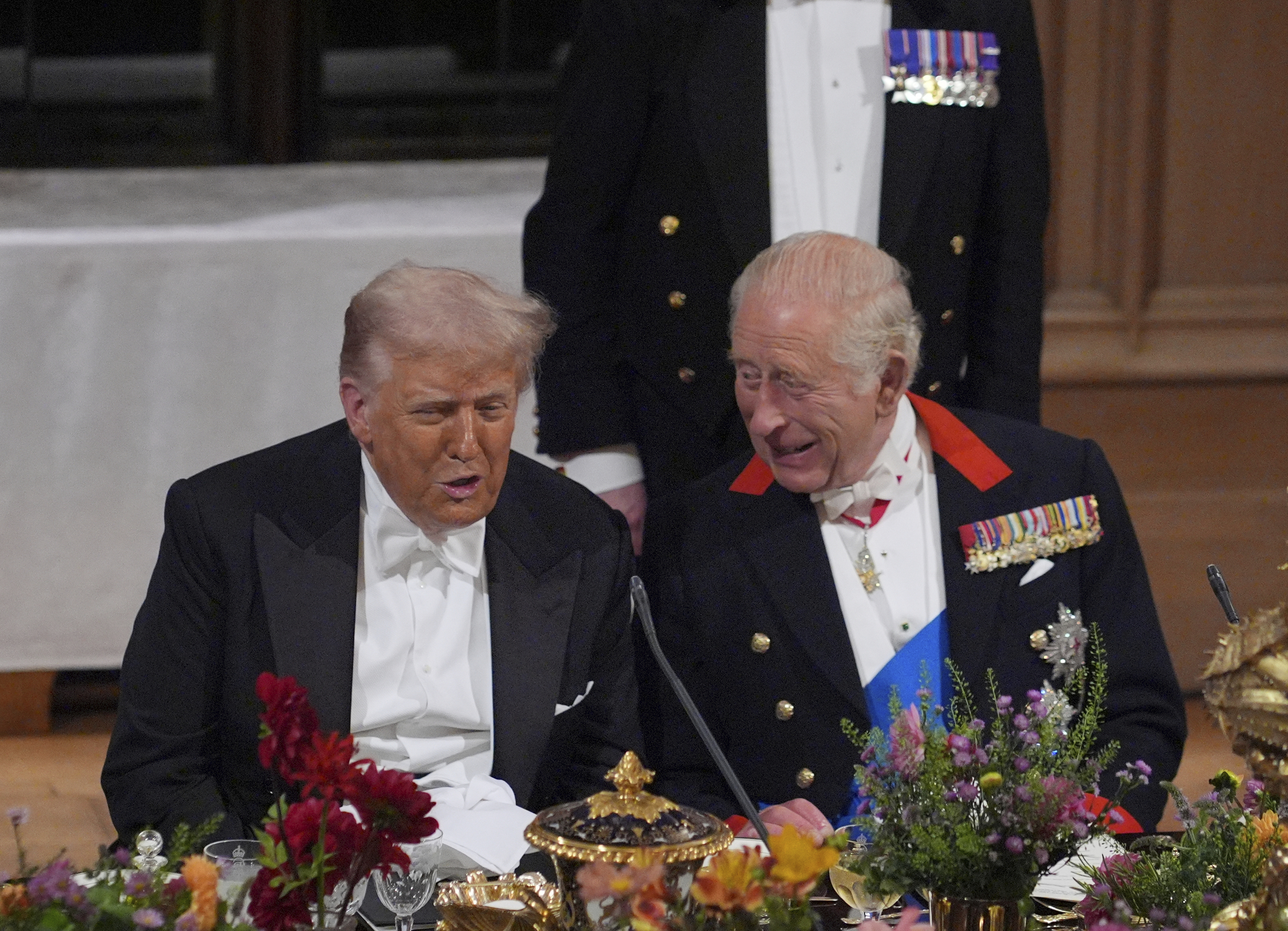 U.S. President Donald Trump, left, and Britain's King Charles speak during the State Banquet in Windsor Castle.