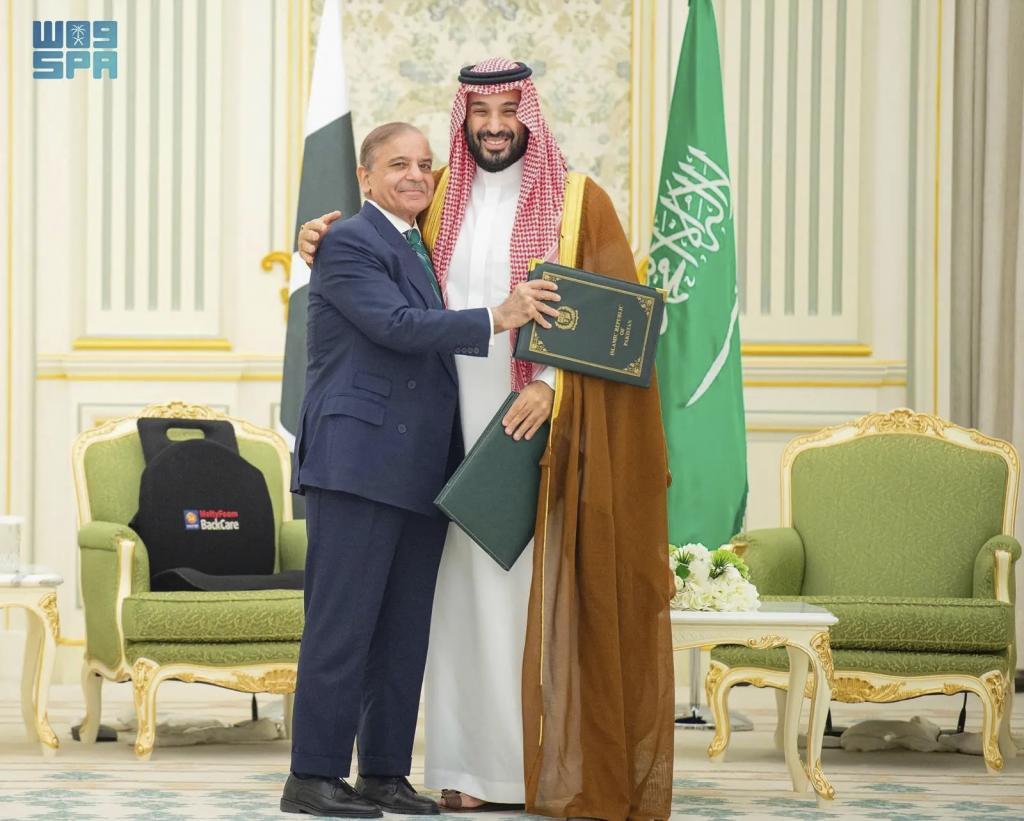 Pakistani Prime Minister Shehbaz Sharif, left, embracing Saudi Arabia's Crown Prince Mohammed bin Salman