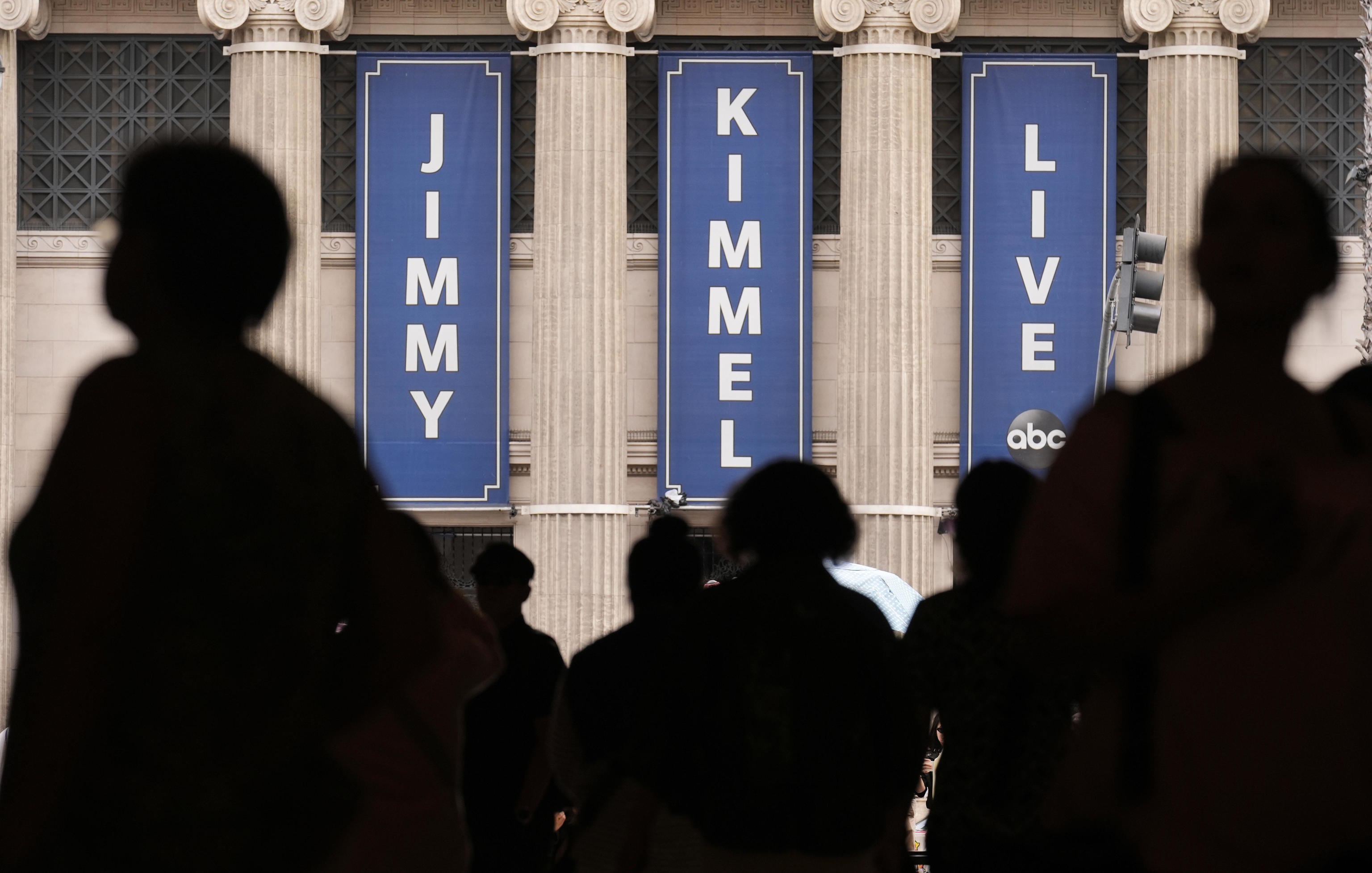 People walk by the Jimmy Kimmel Live studio on Hollywood Blvd.