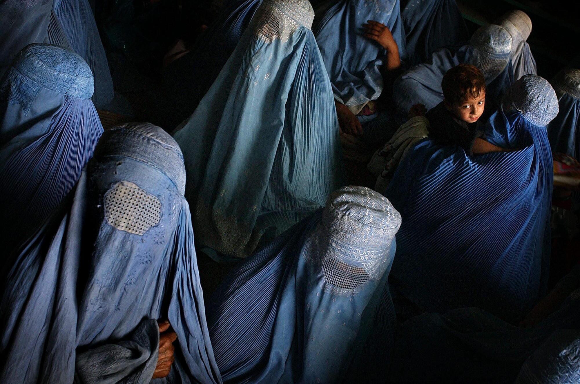Afghan women wearing burqas.