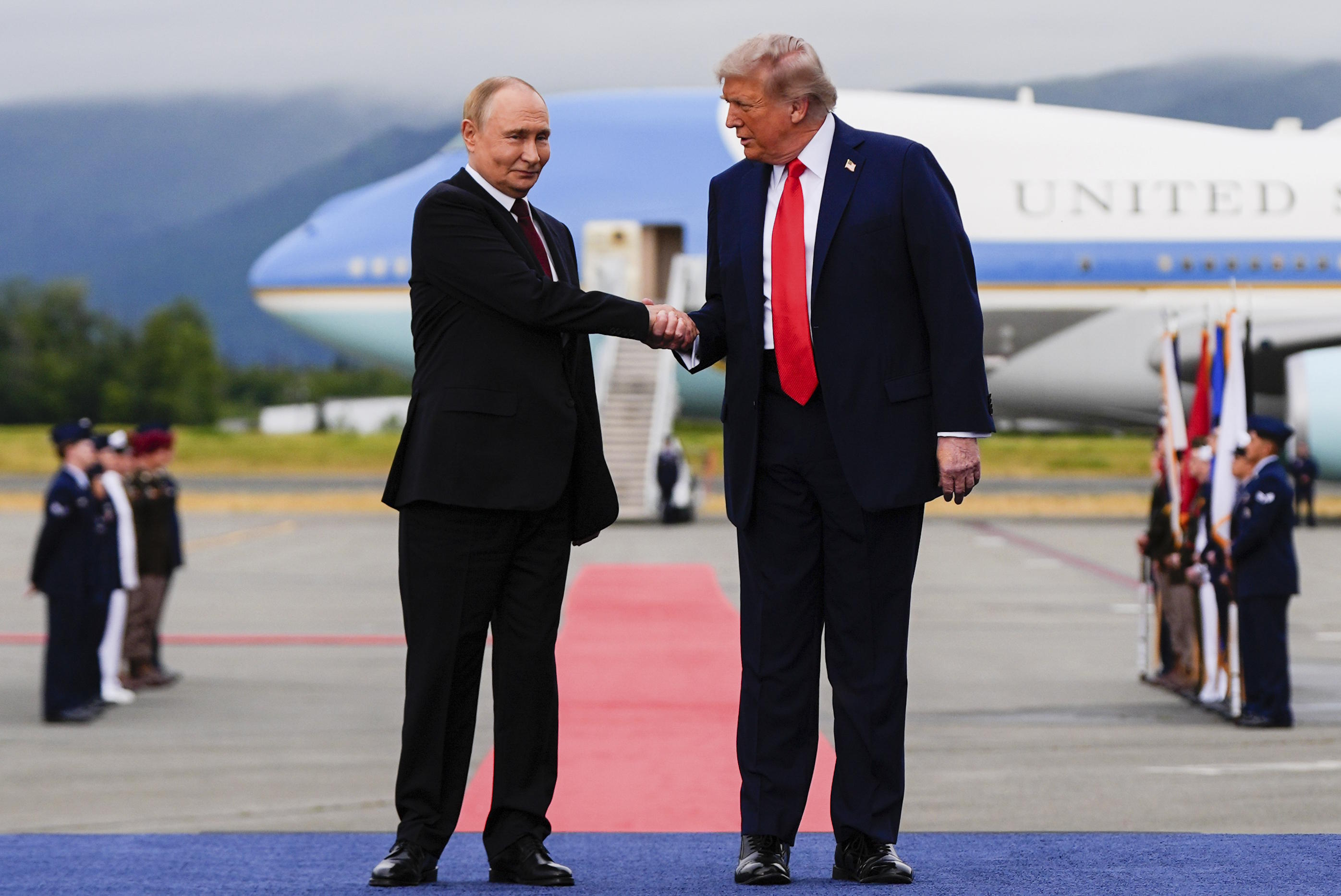 President Donald Trump greets Russia's President Vladimir Putin.