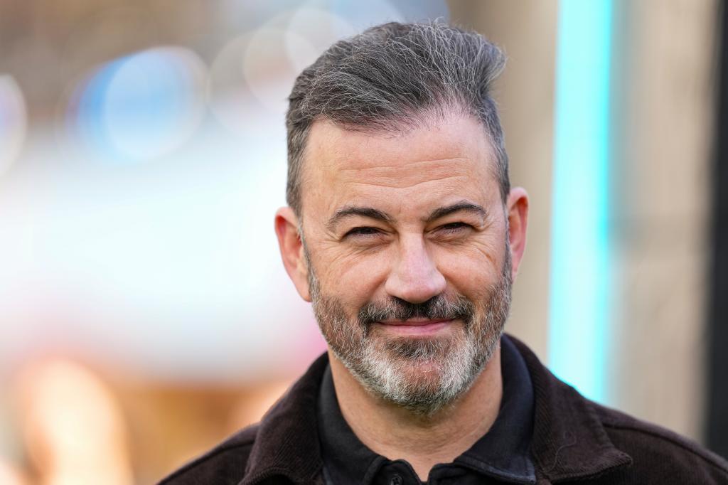 Jimmy Kimmel poses for photographers.