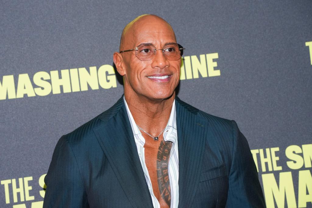 Dwayne Johnson poses for photographers upon arrival at the premiere of the film 'The Smashing Machine'