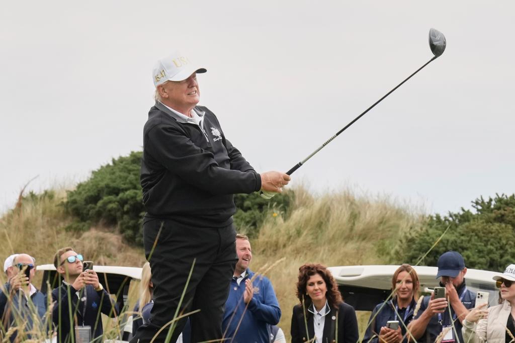 President Donald Trump tees off during the opening ceremony for the Trump International Golf Links golf course,