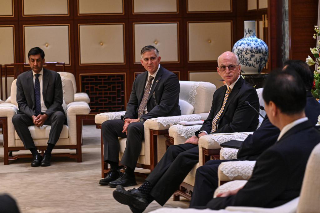 From left, Republican member of House Foreign Affairs Committee Michael Baumgartner and Democratic member of House Armed Services Committee Ro Khanna listen as U.S. Representative Adam Smith, centre, speaks with Shanghai Mayor Gong Zheng