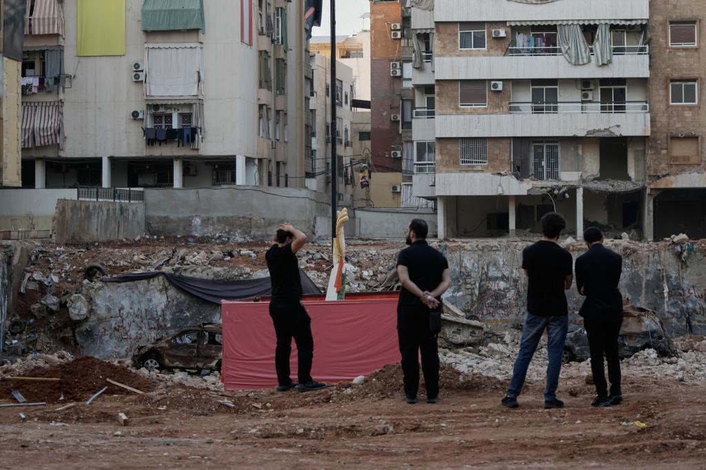 People gather at the site where Hezbollah leader Hassan Nasrallah was killed in Israeli airstrikes