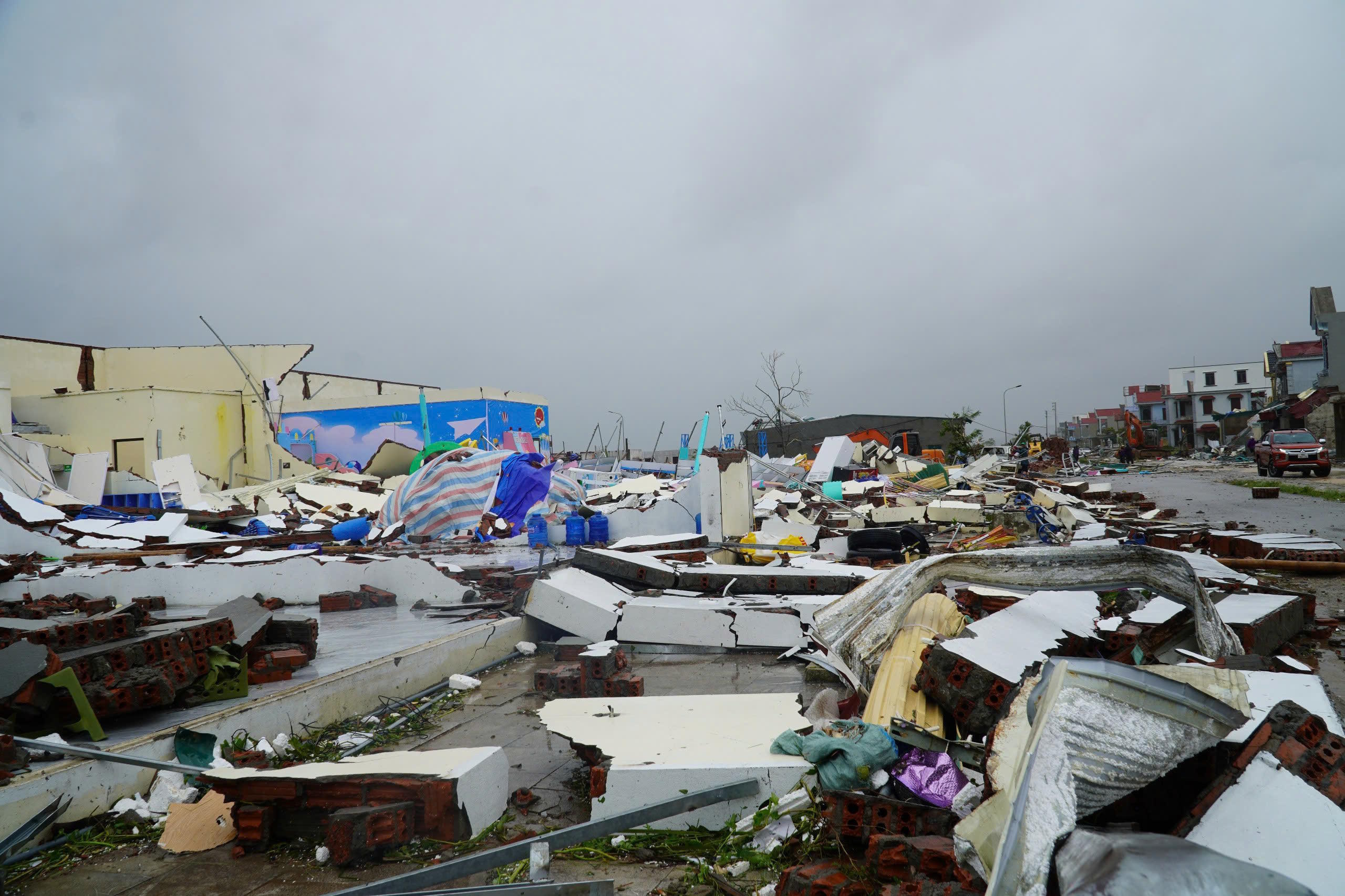 Buildings are seen collapsed to the ground after Typhoon Bualoi swept through Thanh Hoa.