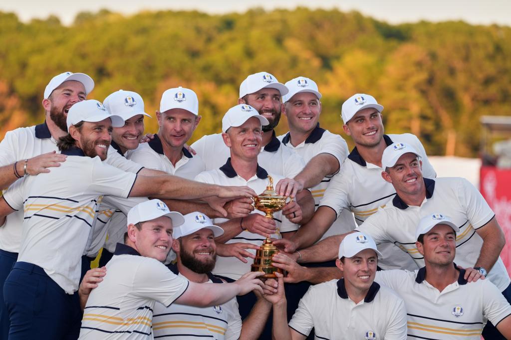 Europe poses with the trophy after winning the Ryder Cup golf tournament against the United States