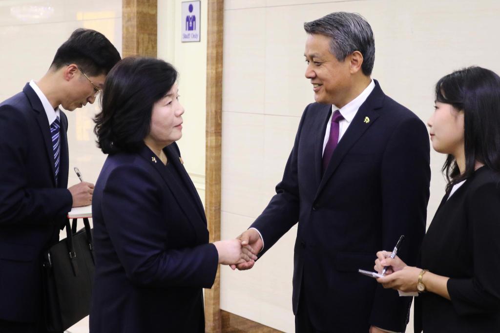North Korean Foreign Minister Choe Son Hui, center left, is greeted by Wang Yajun, Chinese Ambassador to North Korea