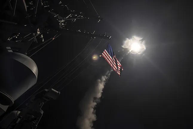Launching a Tomahawk missile from a US warship.