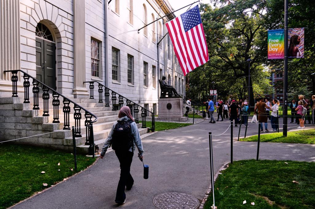 A woman walks through Harvard Yard at Harvard University