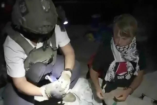 Activist Greta Thunberg alongside an Israeli military officer after their vessel was intercepted.