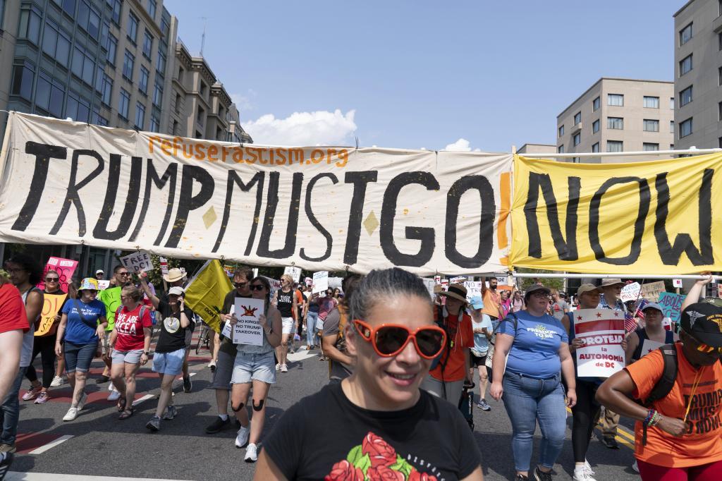 Demonstrators protest against President Donald Trump's deployment of federal law enforcement and National Guard troops in Washington