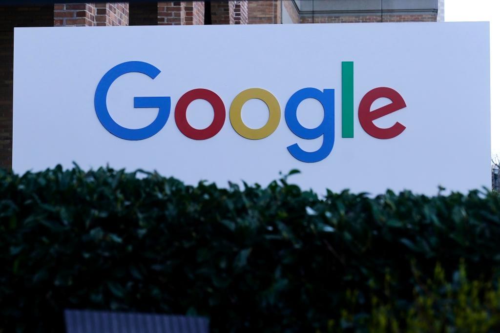 A Google sign is displayed at the company's office in San Francisco