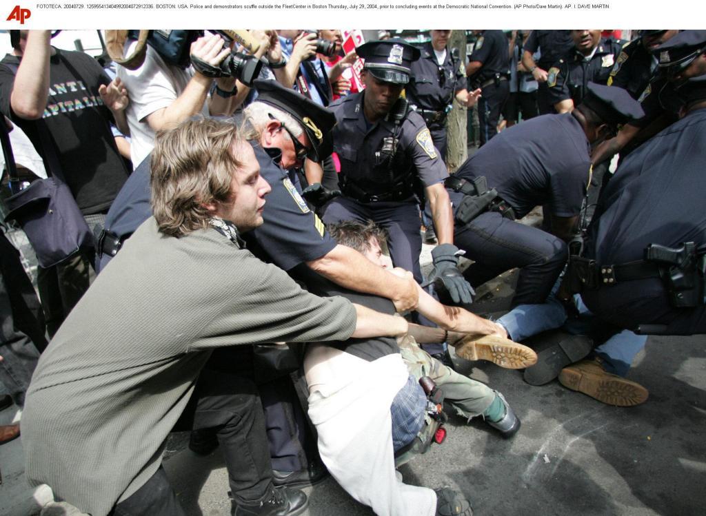Police and demonstrators scuffle outside the FleetCenter in Boston Thursday, July 29, 2004