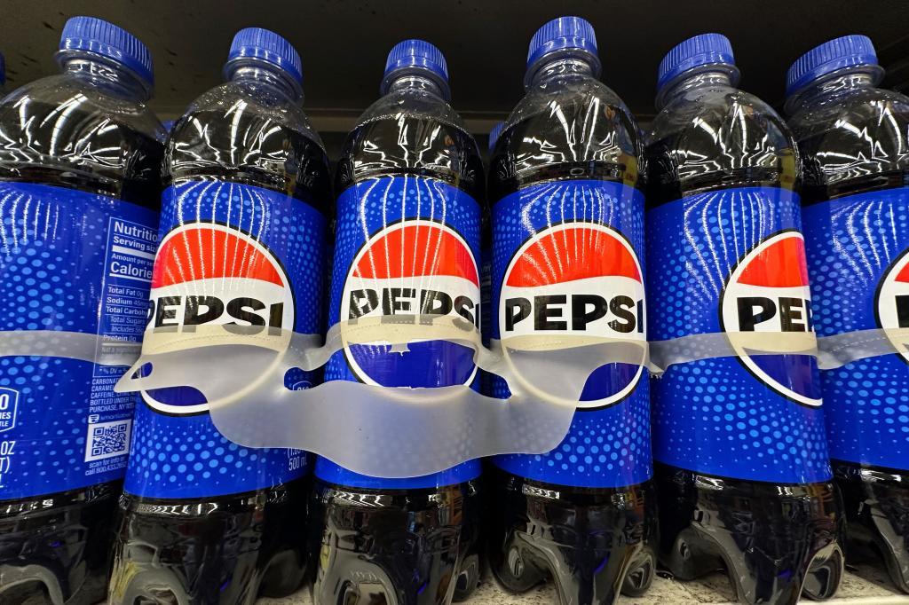 Bottles of Pepsi are displayed at a grocery store