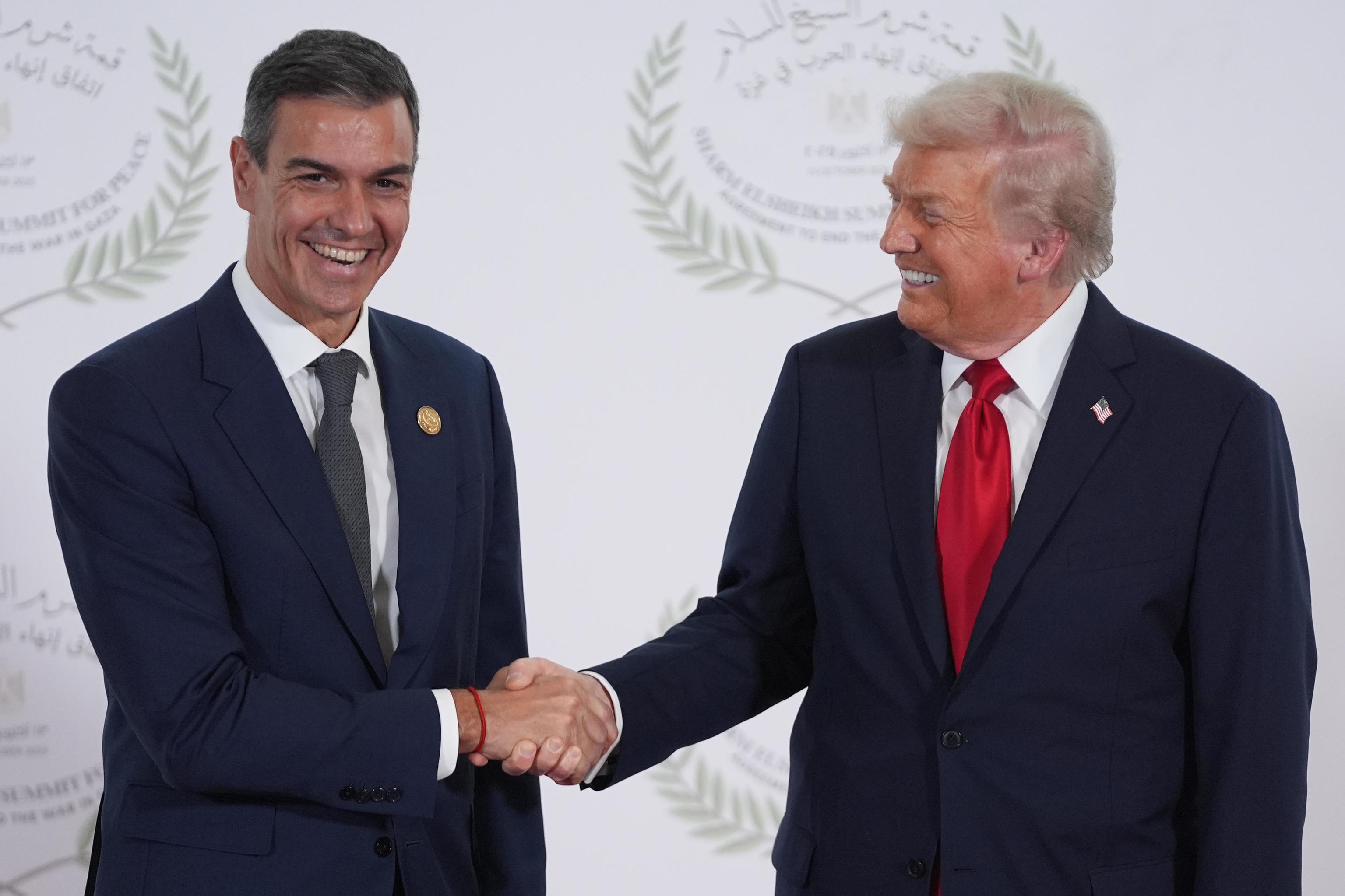 President Donald Trump greets Spain's Prime Minister Pedro Sanchez.