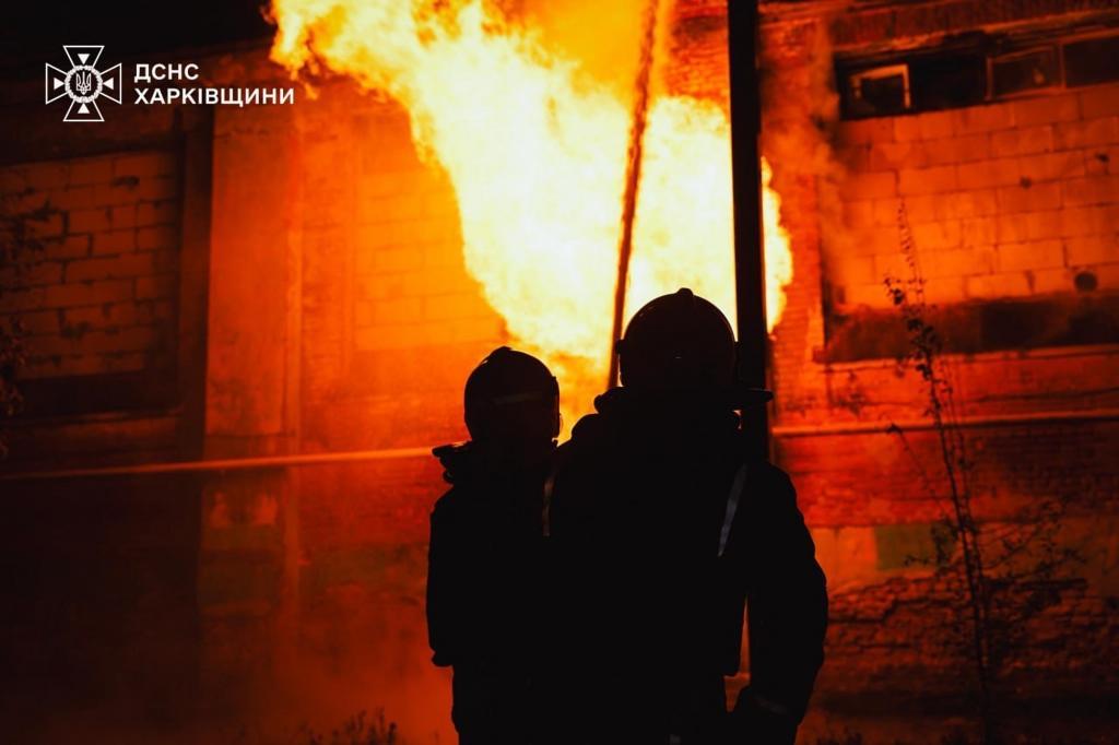 Rescue workers put out a fire of a hospital damaged by a Russian strike
