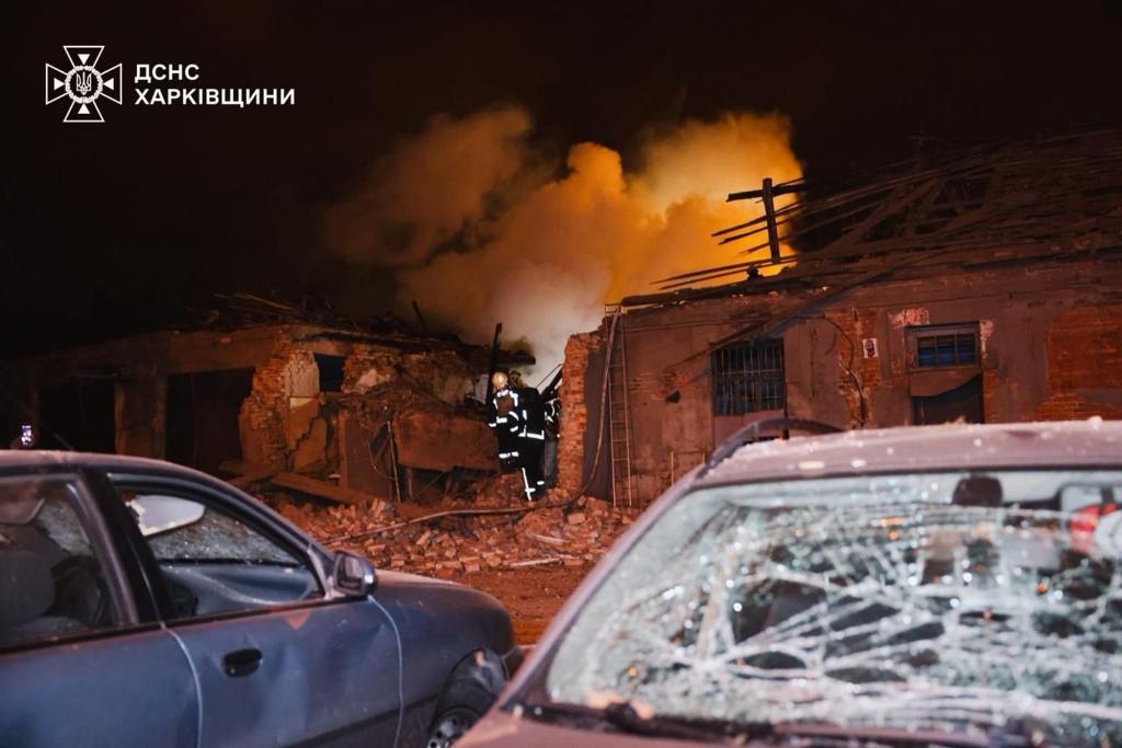 Rescue workers put out a fire of a hospital damaged by a Russian strike