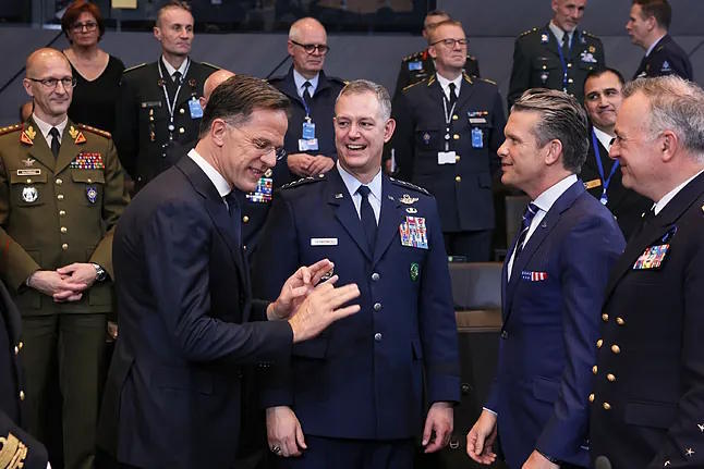 U.S. Secretary of Defense Pete Hegseth speaks with NATO Secretary-General Mark Rutte and with the commander of allied forces in Europe, General Alexus G. Grynkewich.