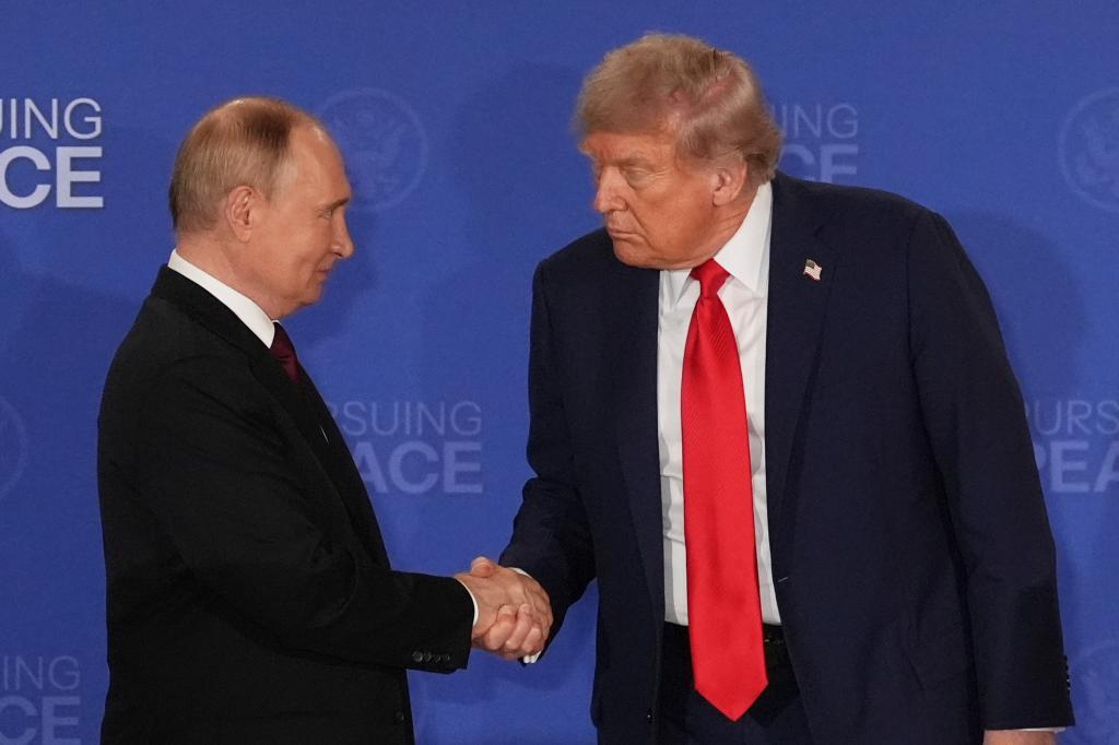President Donald Trump, right, shakes the hand of Russia's President Vladimir Putin