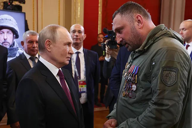 Vladimir Putin, with one of his military bloggers, in Moscow.