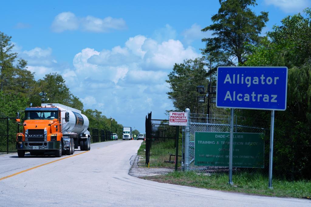Trucks come and go from the "Alligator Alcatraz" immigration detention center in the Florida Everglades