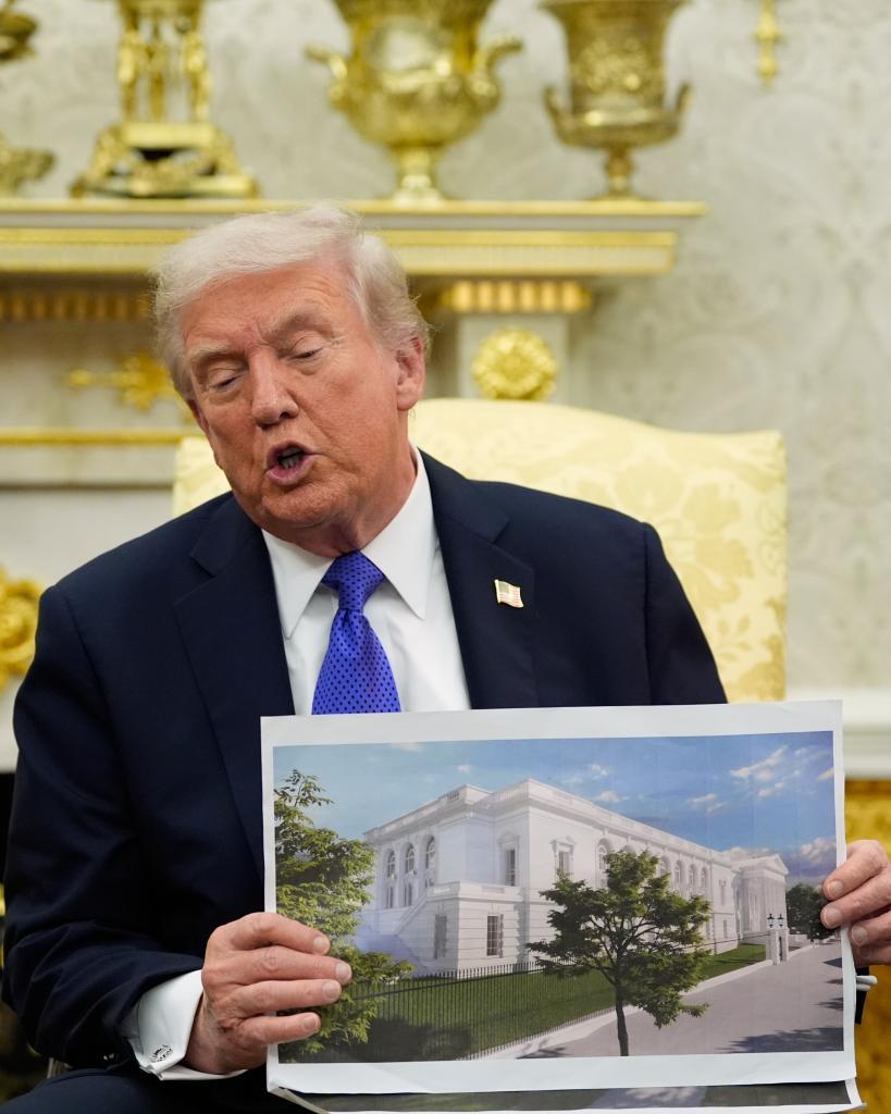 President Donald Trump holds an artist rendering of the new White House ballroom