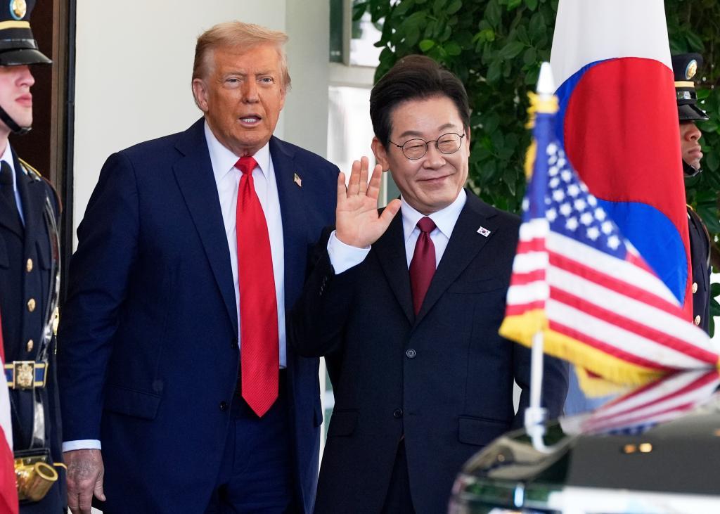 President Donald Trump, left, greets South Korean President Lee Jae Myung