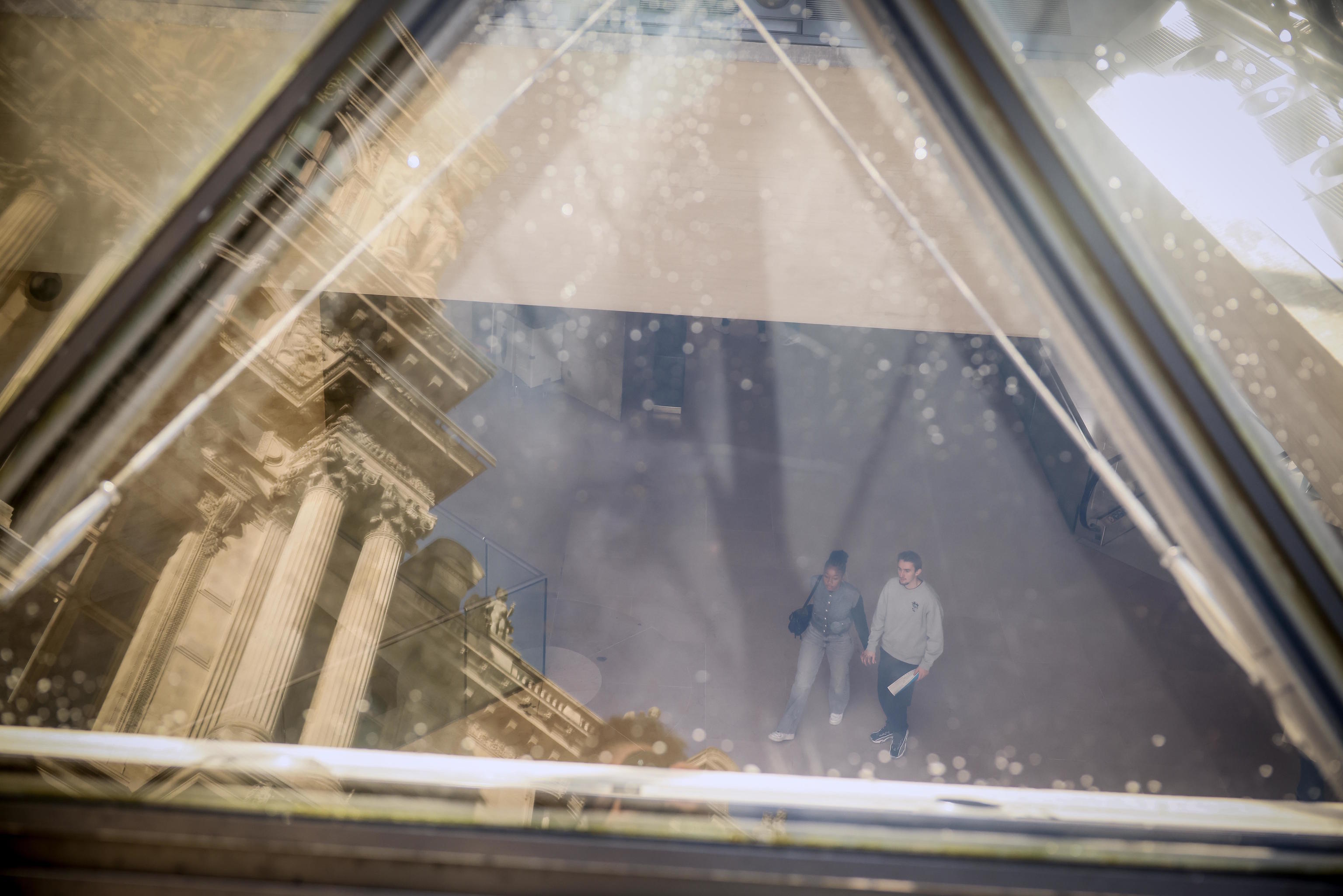 Visitors tour the Louvre museum, one week after the robbery.