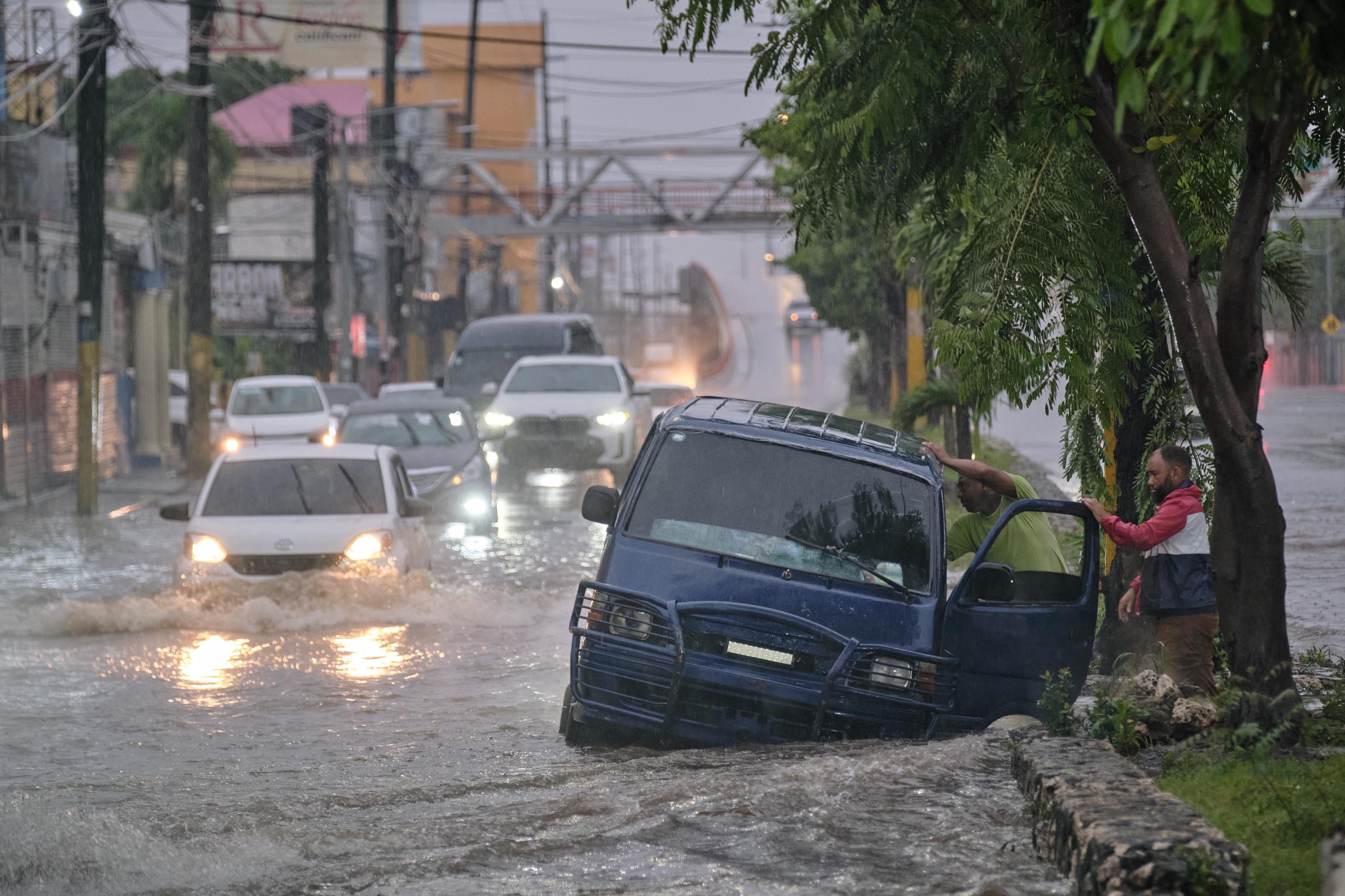 An impassable street flooded by rains in Dominican Republic.