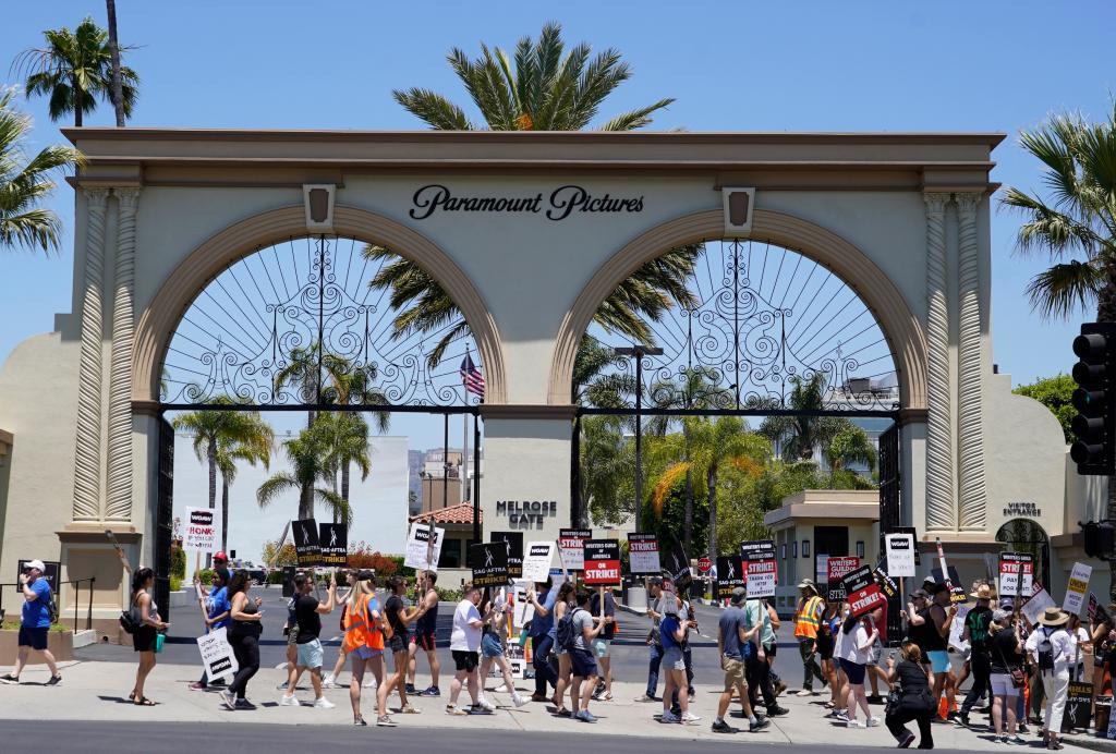 Striking writers and actors take part in a rally outside Paramount studios in Los Angeles