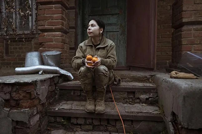 Katherina Petrenko, in one of the houses occupied by her combat unit, in the city of Kramatorsk.