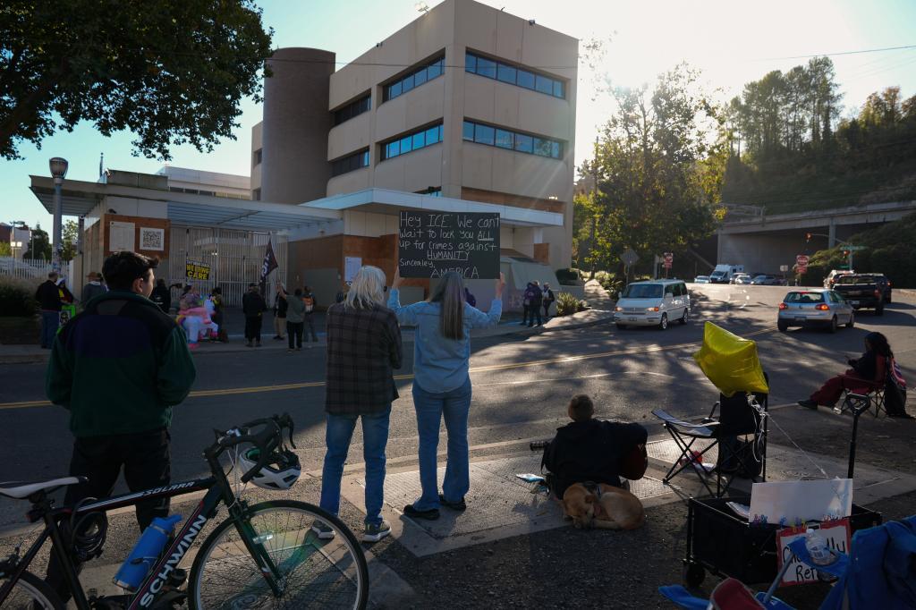 People protest outside a United States Immigration and Customs Enforcement (ICE) facility in Portland