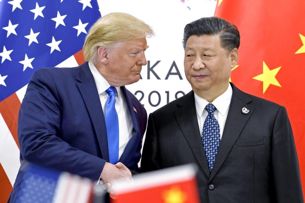 President Donald Trump, left, shakes hands with China's President Xi Jinping