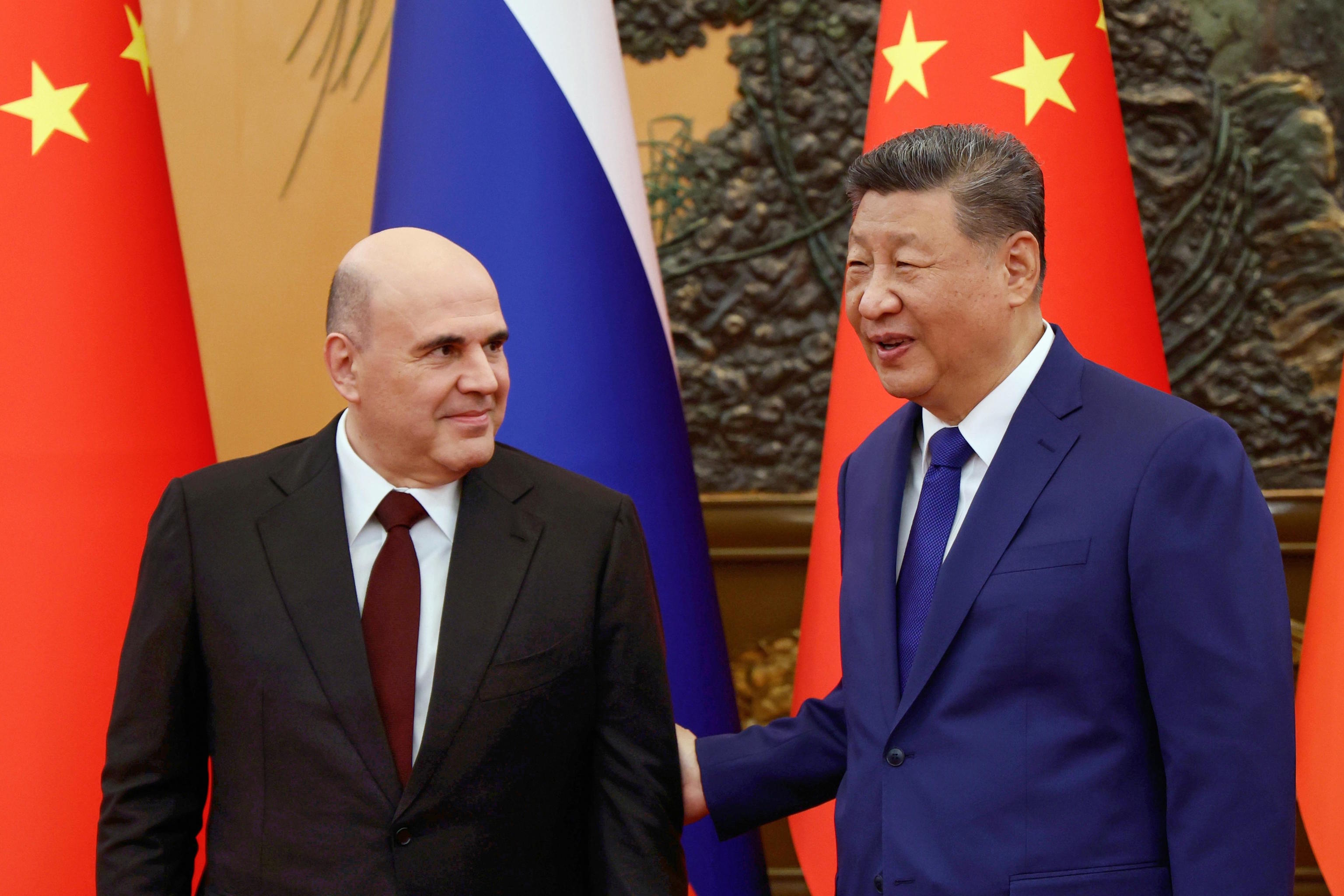 Russian Prime Minister Mikhail Mishustin and Chinese President Xi Jinping.