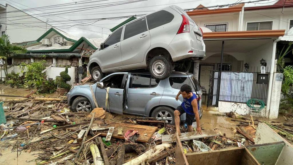 Vehicles lie piled on after flooding caused by Typhoon Kalmaegi in Cebu city