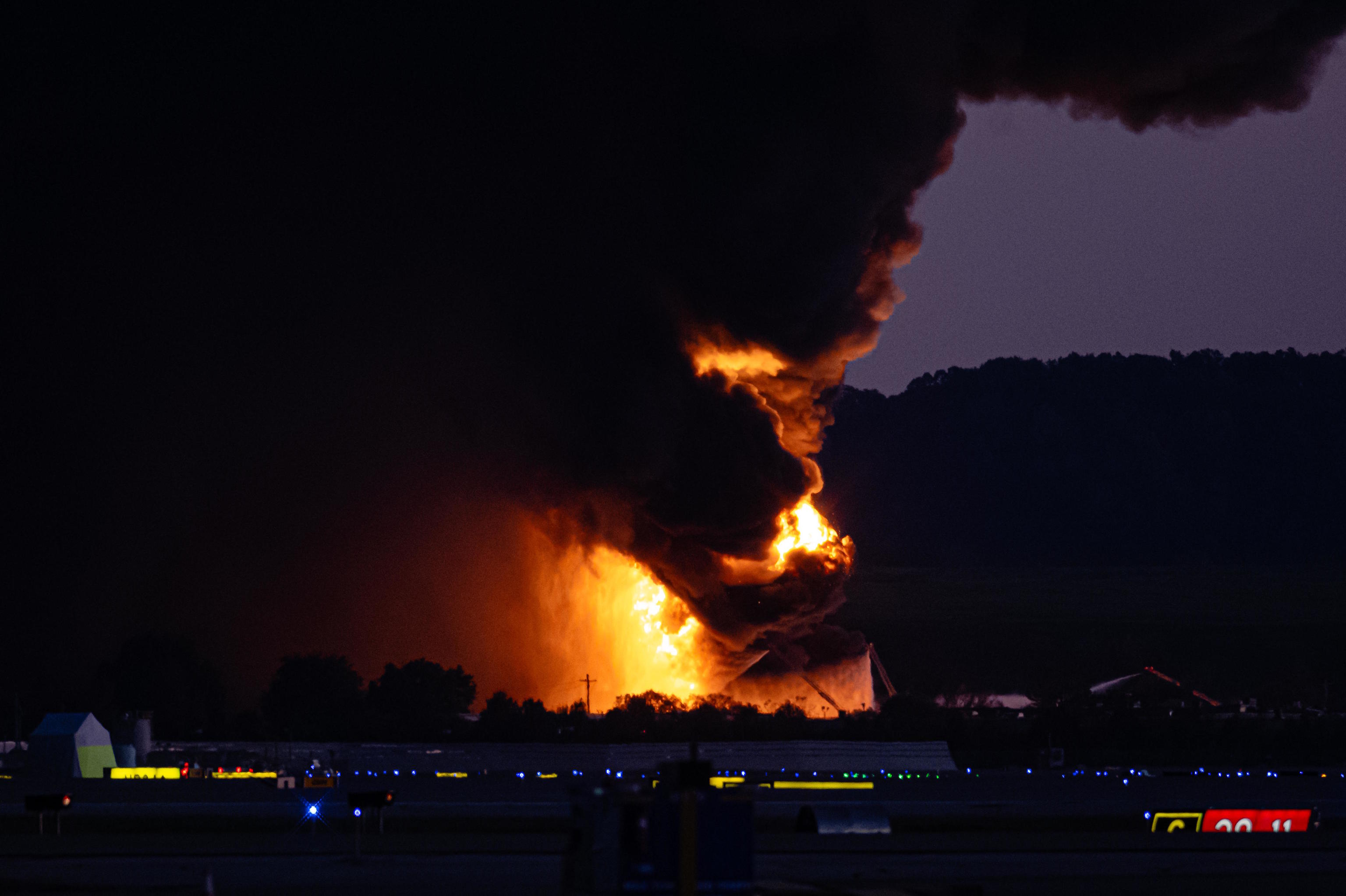 A column of fire and smoke rises near Louisville International Airport.